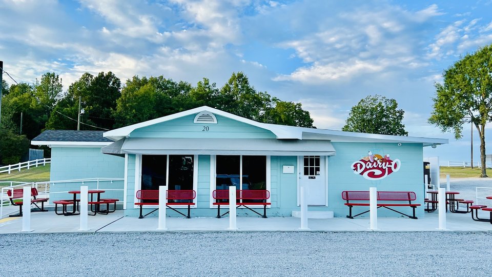Burgers and shakes served in a bright diner setting.